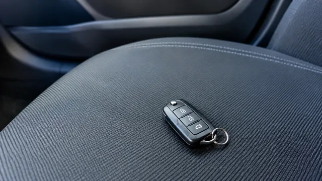 KI-Symbolbild: ein einzelner Autoschlüssel mit Schlüsselring auf dem Beifahrersitz